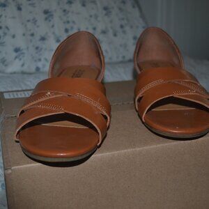 Pre-owned pair of A.N.A. cognac color flat sandals. Criss-cross straps, size 8 m